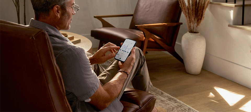 gentlemen managing glucose levels on his phone