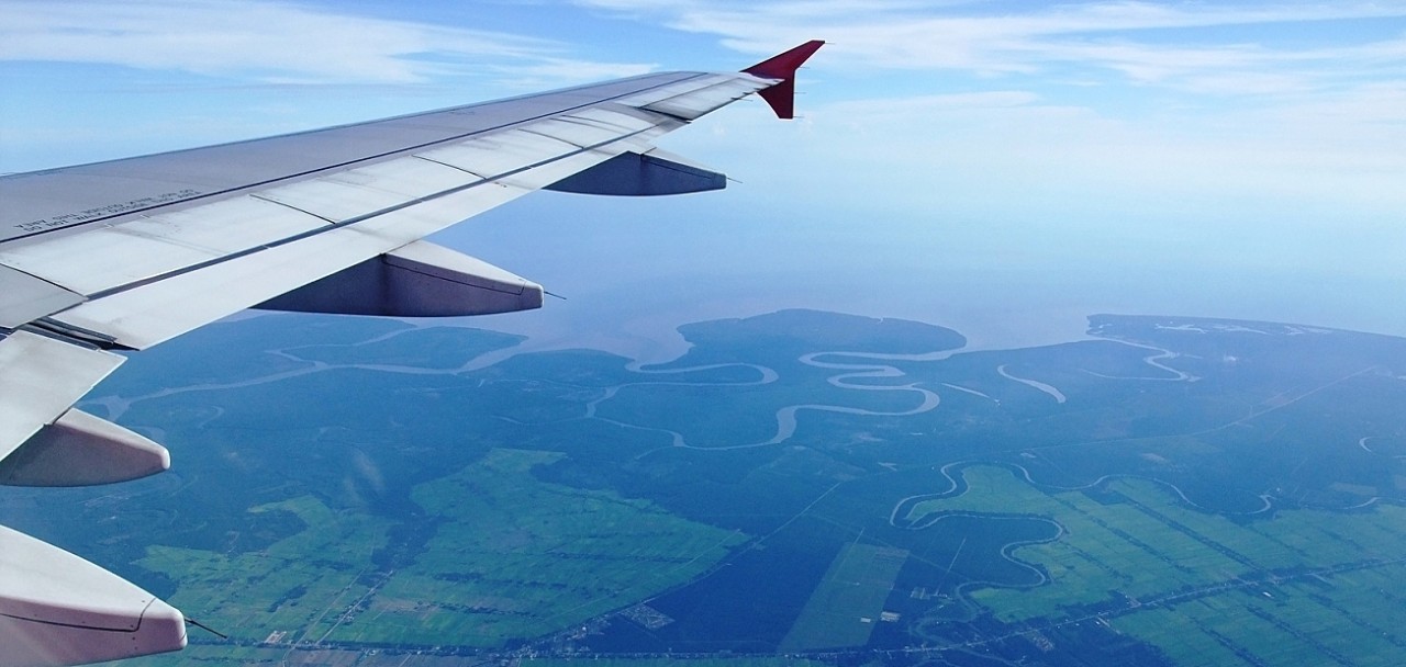 Aerial view from airplane airplane with beautiful sky