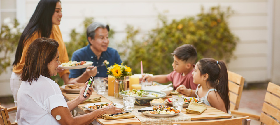 Family sitting together eating healthy dinner
