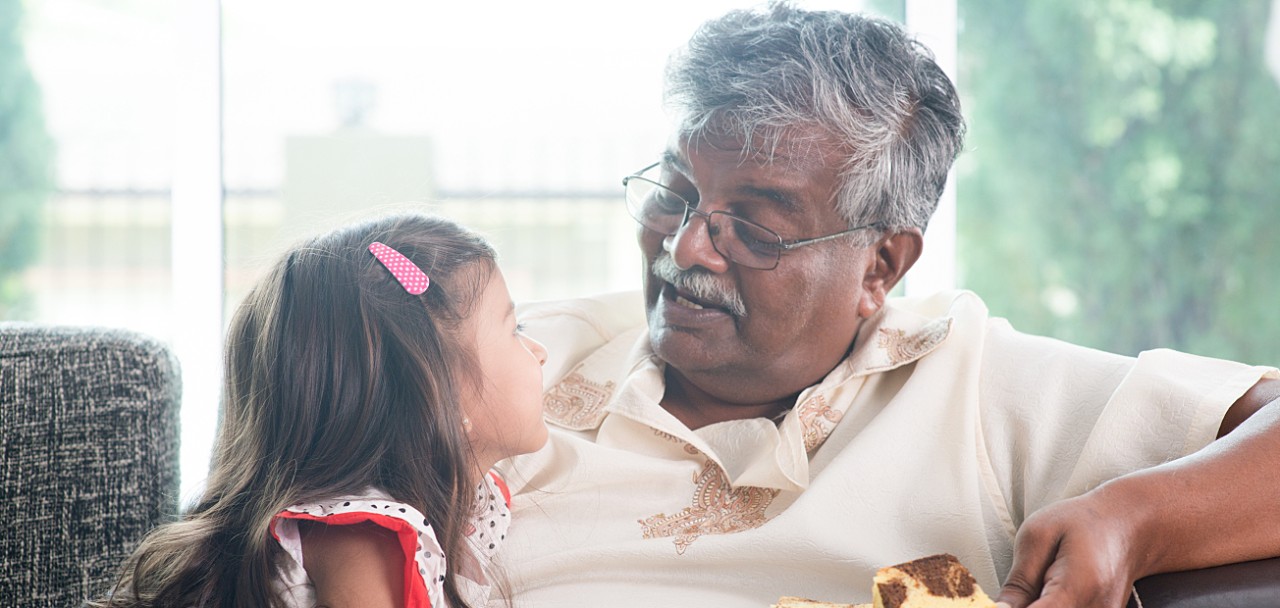 Portrait of Indian family at home. Grandparent and grandchild eating butter cake. Asian people living lifestyle. Grandfather and granddaughter.; Shutterstock ID 301636463; PO: 123