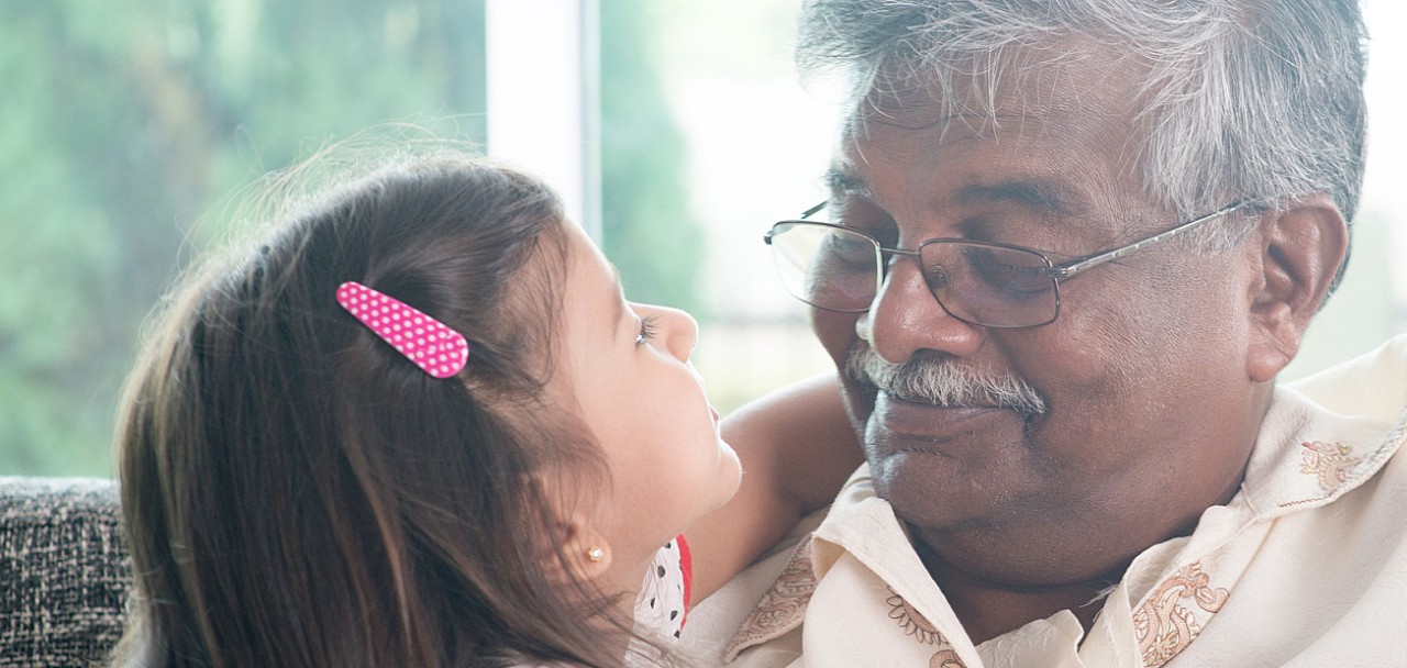 Portrait Indian family at home. Grandparent and grandchild close up face. Asian people living lifestyle. Grandfather and granddaughter.