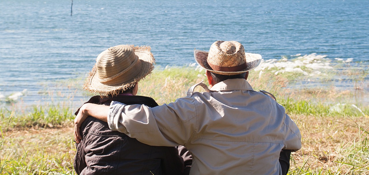 Happy senior travelers sitting together in nature, Healthy senior or older people, Happiness living concept