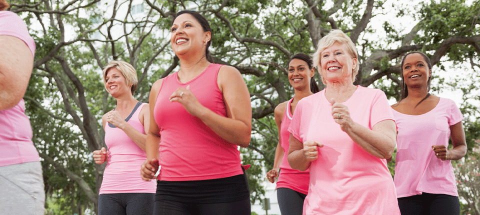 Women in pink tops running
