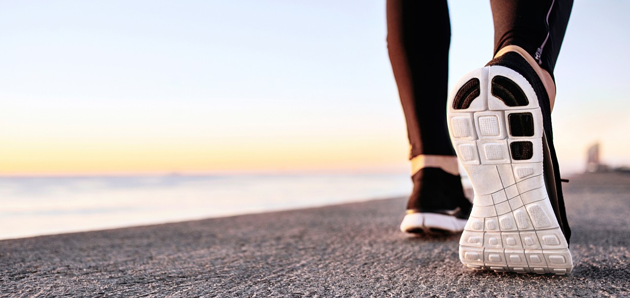 Athlete runner feet running on treadmill closeup on shoe. Jogger fitness shoe in the background and open space around him. Runner jogging training workout exercising power walking outdoors in city.; Shutterstock ID 373271314; PO: 123