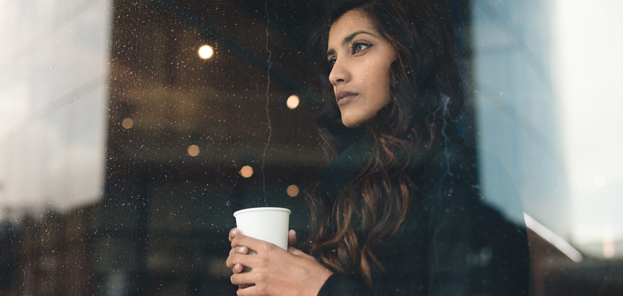 Young woman looking through rainy window; Shutterstock ID 658088836; PO: 123