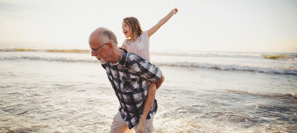 father with his daughter on beach